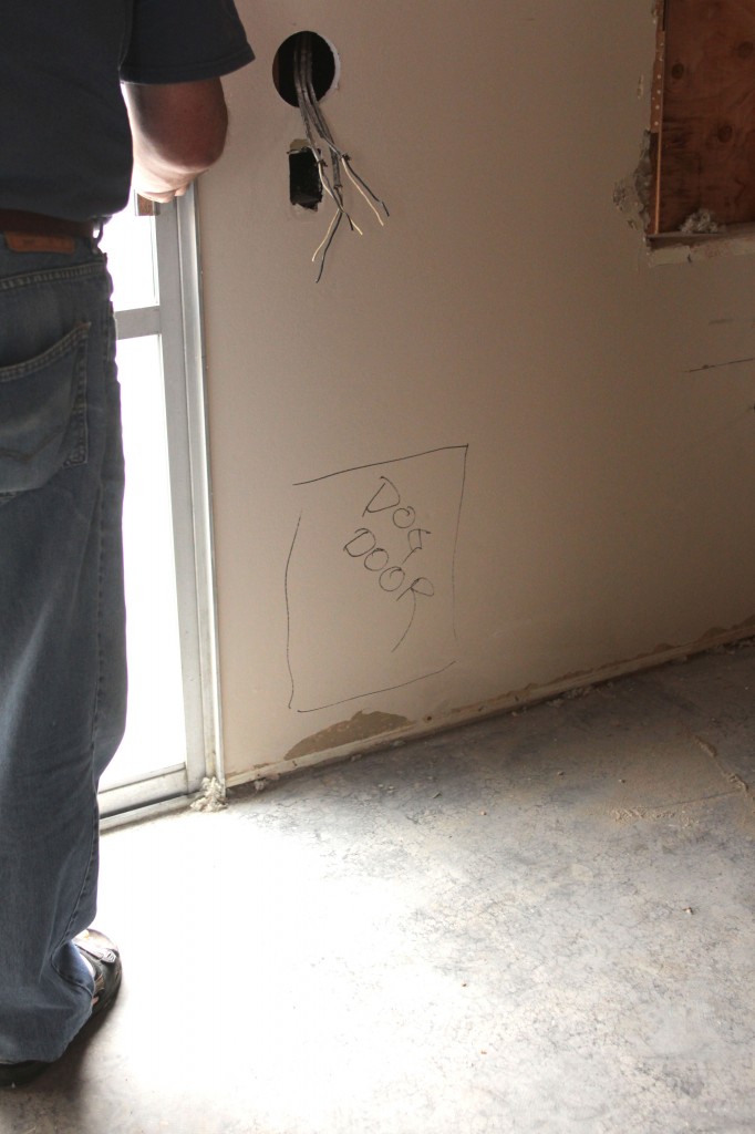 We wrote on the wall and it was great! The contractor now knows where to place the doggie door for our little Macy.  